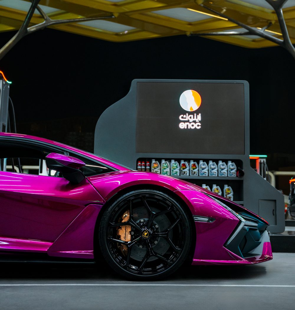 Magenta Lamborghini Revuelto at an ENOC station in Dubai
