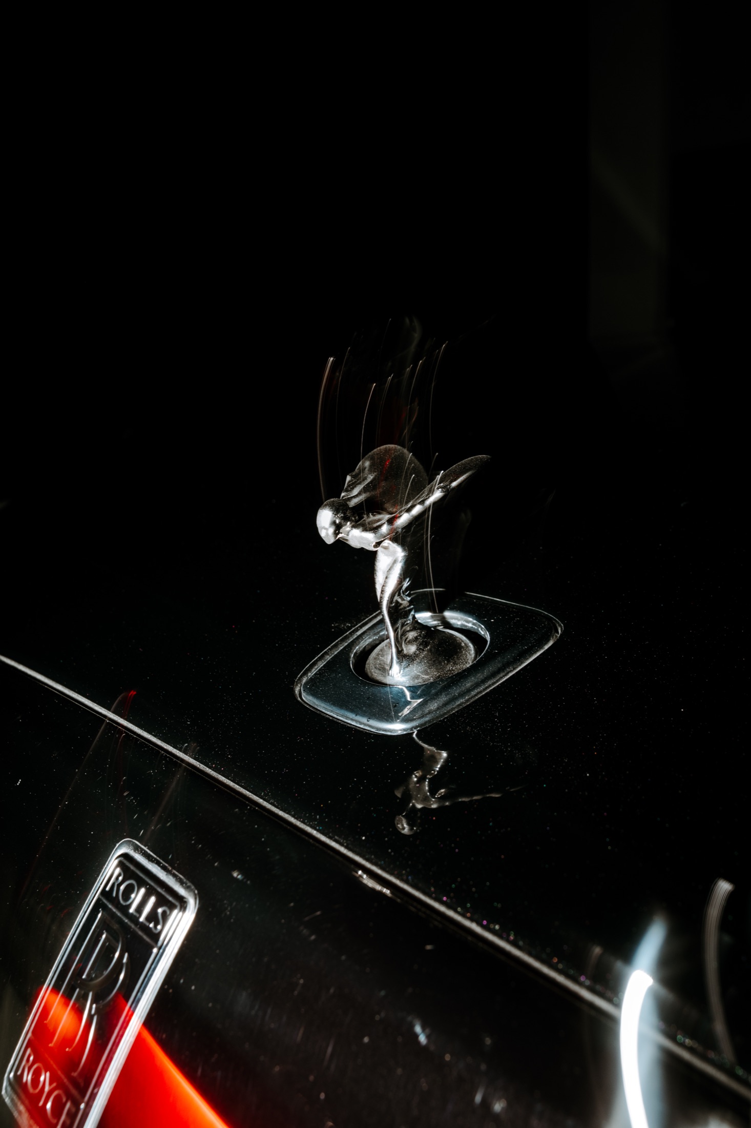 A Rolls-Royce from the Onelink line-up, the Spirit of Ecstasy catching the light.